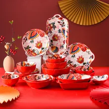Czerwona zastawa stołowa kreatywne ceramiczne płytkie talerze miska do ryżu domowe uroczystość ślubu naczynia i talerze chiński nowy rok talerze tanie tanio CN (pochodzenie) ROUND Floral MA0440 Microwavable Dishwasher safe dinner plates dishes ceramic plate red plates Chinese New Year Dinner Plates