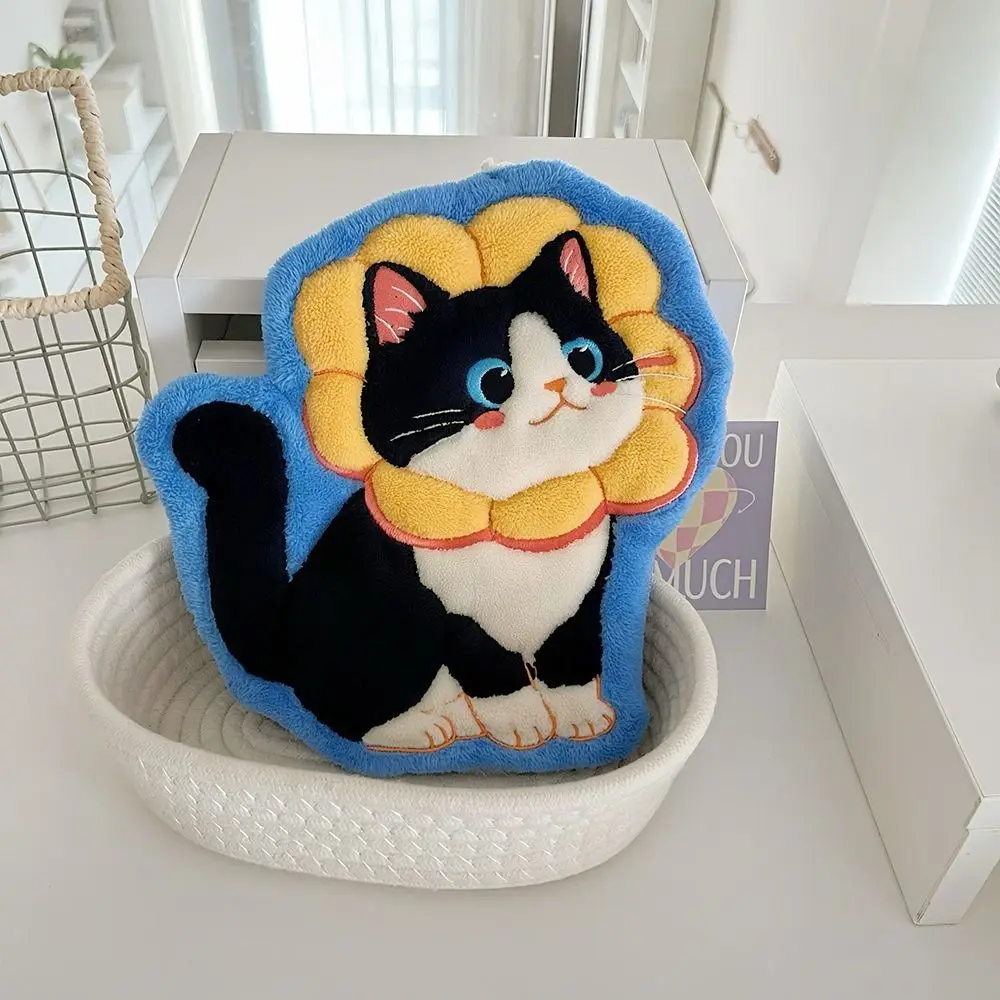 Plush pillow shaped like a black and white cat with a yellow mane, inspired by KittyNook’s Premium Coral Fleece Kitchen Towel.