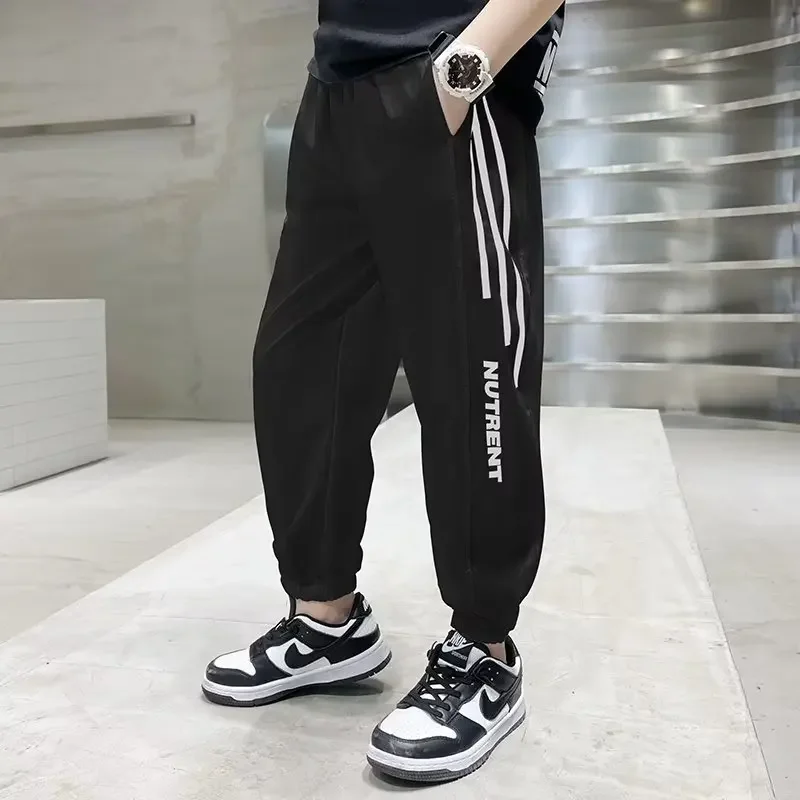 thumbnail image 1 of Pantalones finos a prueba de mosquitos de seda de hielo para niños, pantalones de chándal de nuevo estilo, pantalones informales de secado rápido para niños de mediana a grande, verano 2023, 1 of 4