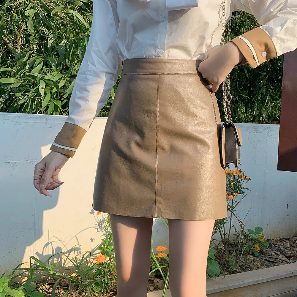 Minifalda negra de cuero PU de cintura alta para mujer, falda adelgazante de media longitud, estilo transfronterizo informal cómodo