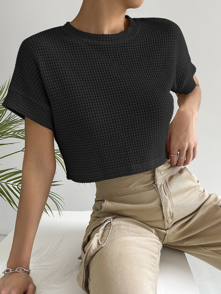 The women's summer light and casual short-sleeved knitted sweater is designed with a brand-new hollow and elegant round neck