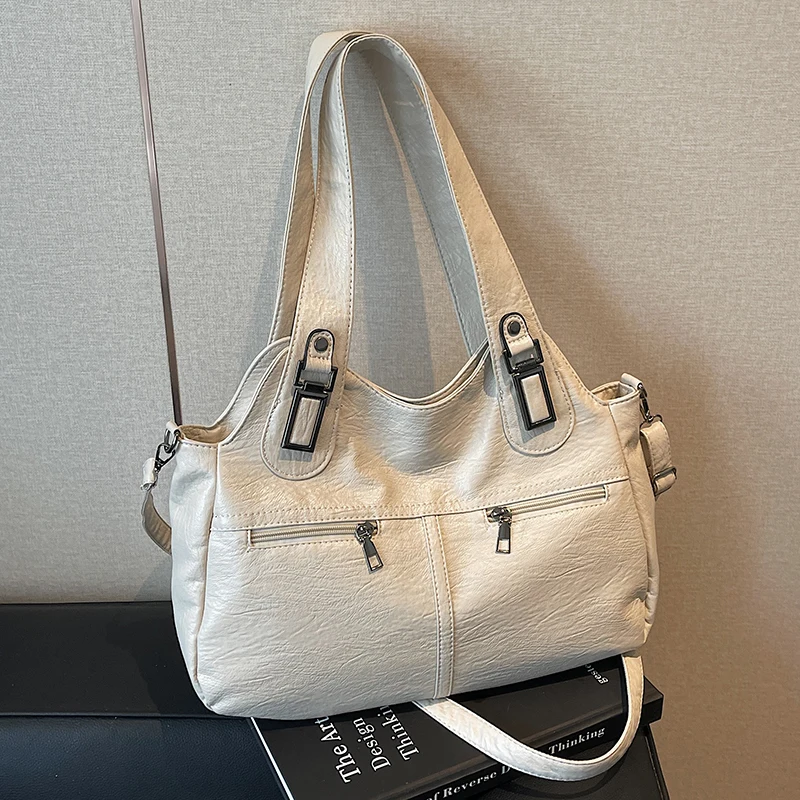 Fashionable women’s large-capacity handbag with casual crossbody design, perfect for commuting and daily style. beige