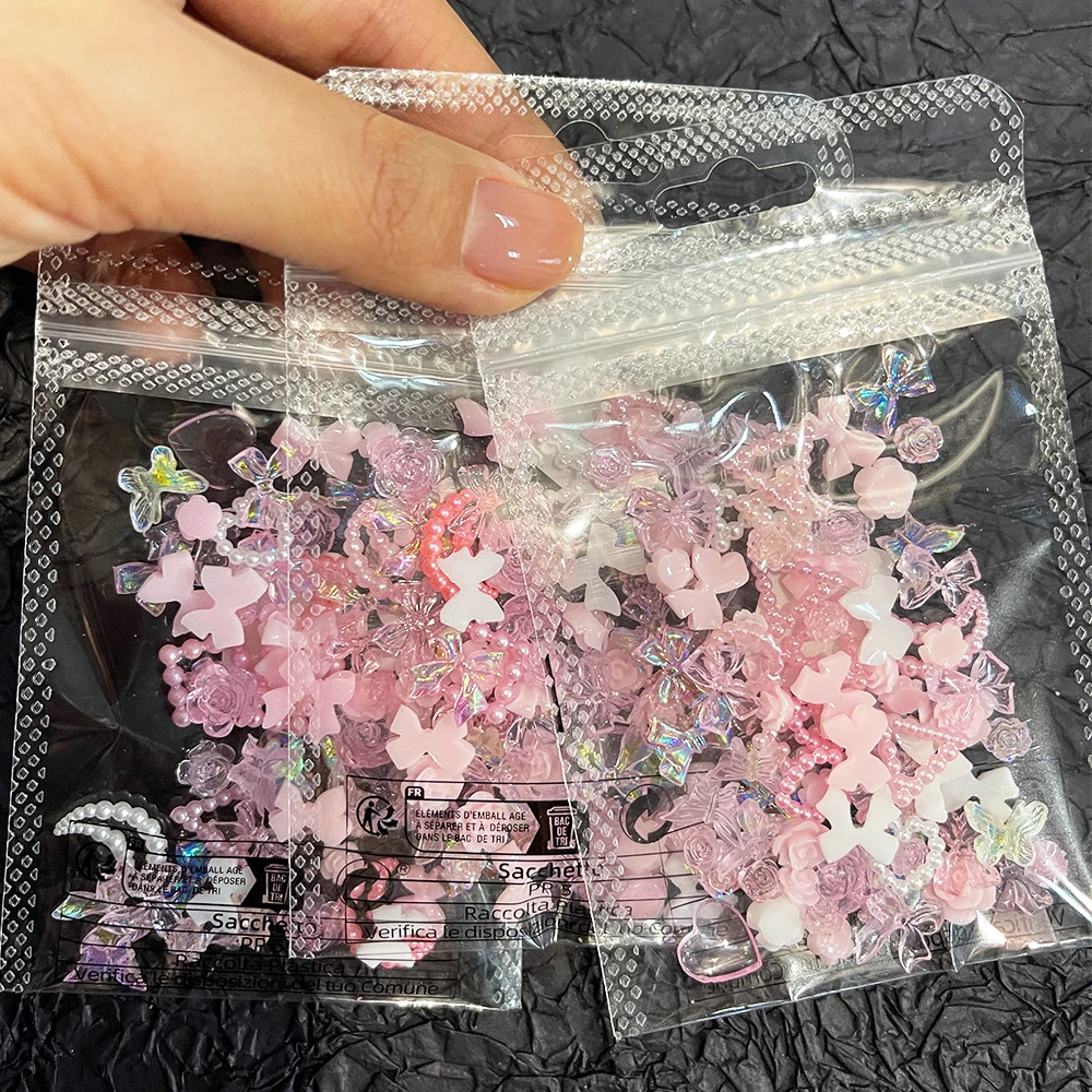 50Pcs 진주 핑크 Bowknot 하트 모양의 라인 석 혼합 네일 장식 Kawaii 꽃 나비 매력 DIY 네일 액세서리