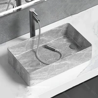 อ่างล้างหน้าเซรามิกดีไซน์หรูทันสมัยสำหรับห้องน้ำ อ่างล้างหน้าแบบวางบนเคาน์เตอร์พร้อมอุปกรณ์ระบายน้ำ 5