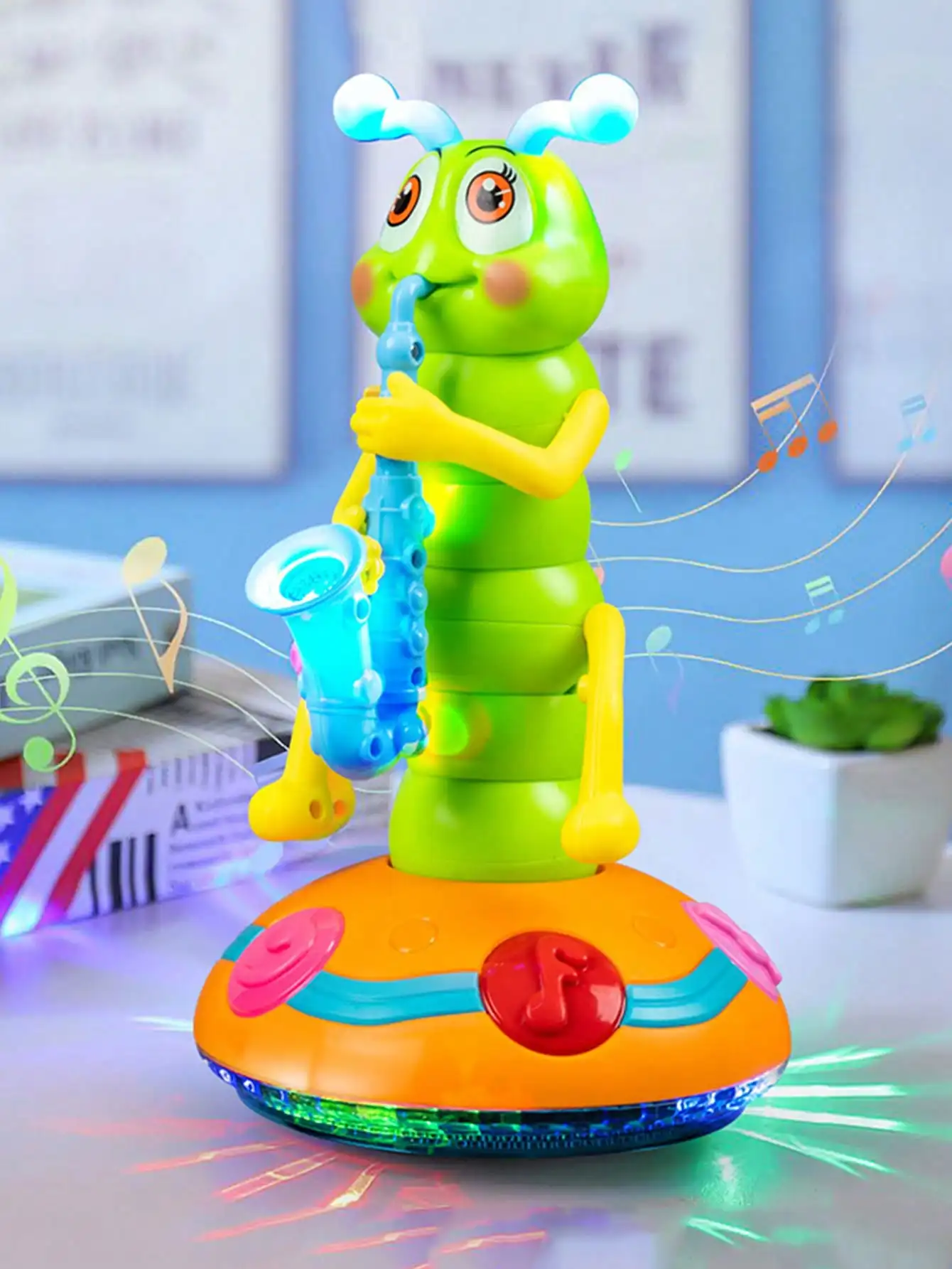 Baby crawling behind a colourful musical caterpillar toy