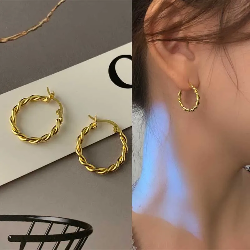 Large metal hoop earrings photographed from above