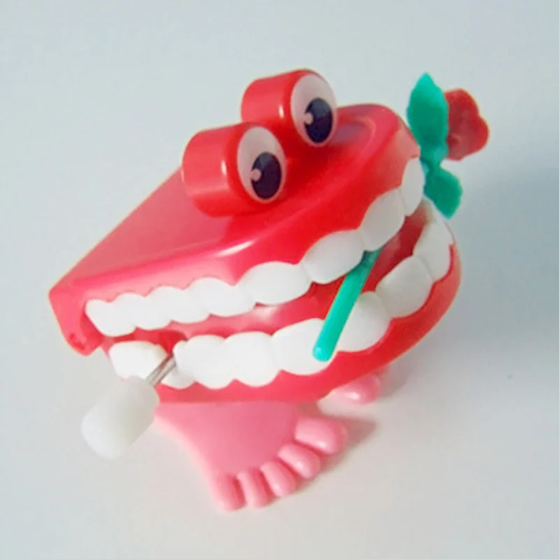 時計仕掛けのおもちゃアッパーチェーンジャンプ歯のおもちゃ子供