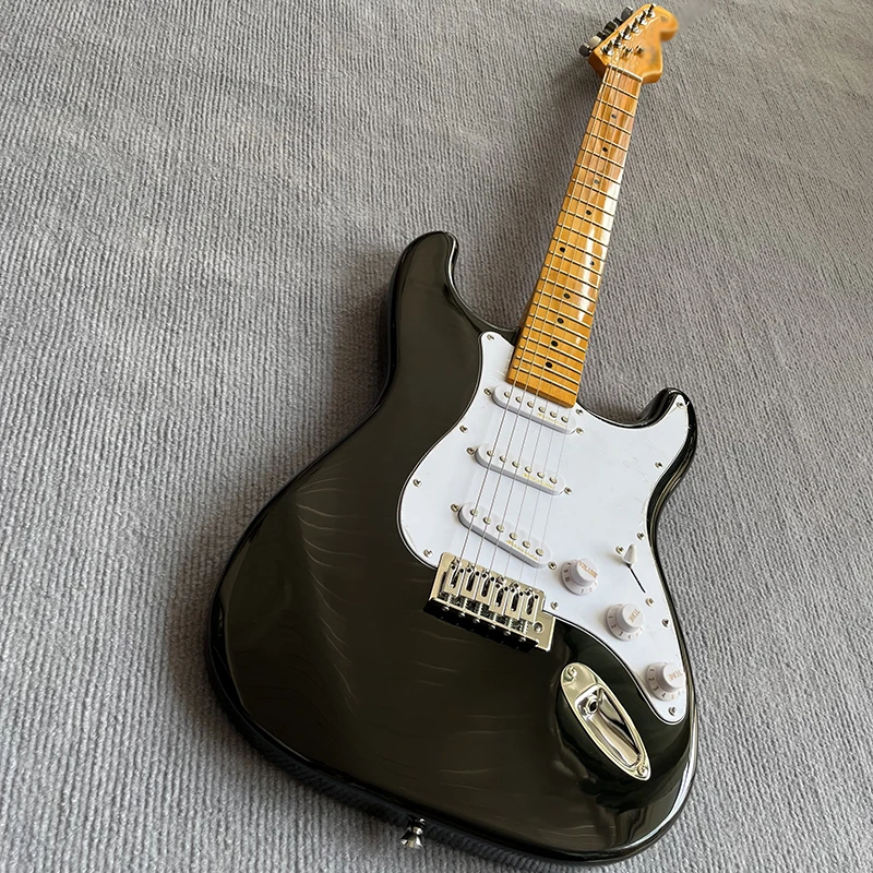

Classic electric guitar, bright black paint surface, three single pickup system, maple neck, good timbre, free delivery to home.