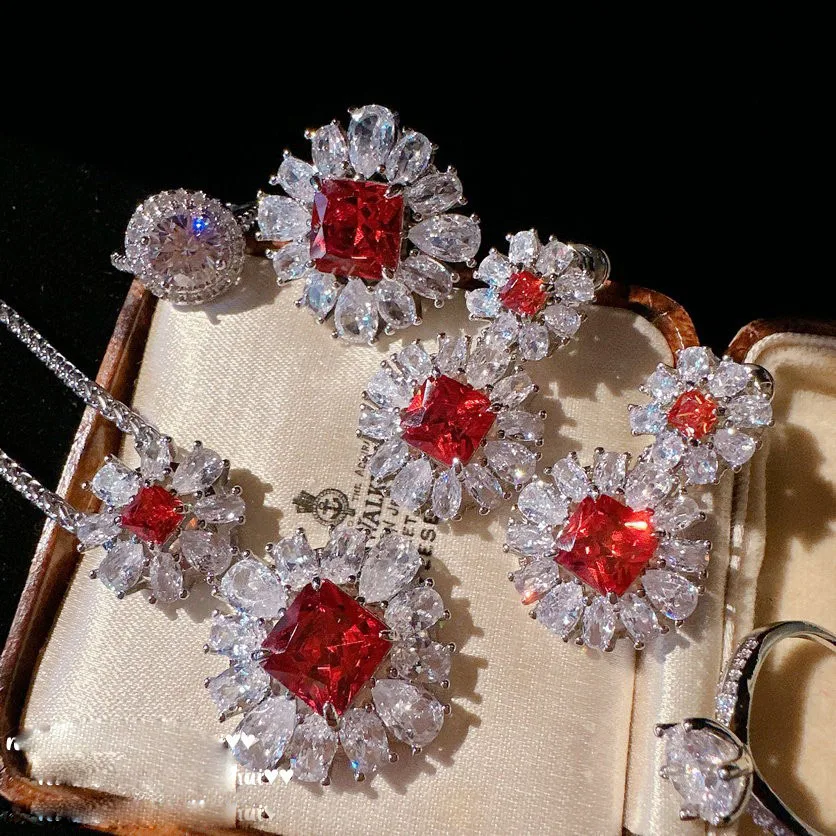 

Sotheby's Frost Flower Pigeon Blood Ruby Necklace Plated with 18K Gold Pomegranate Red Snowflake Zircon Earrings