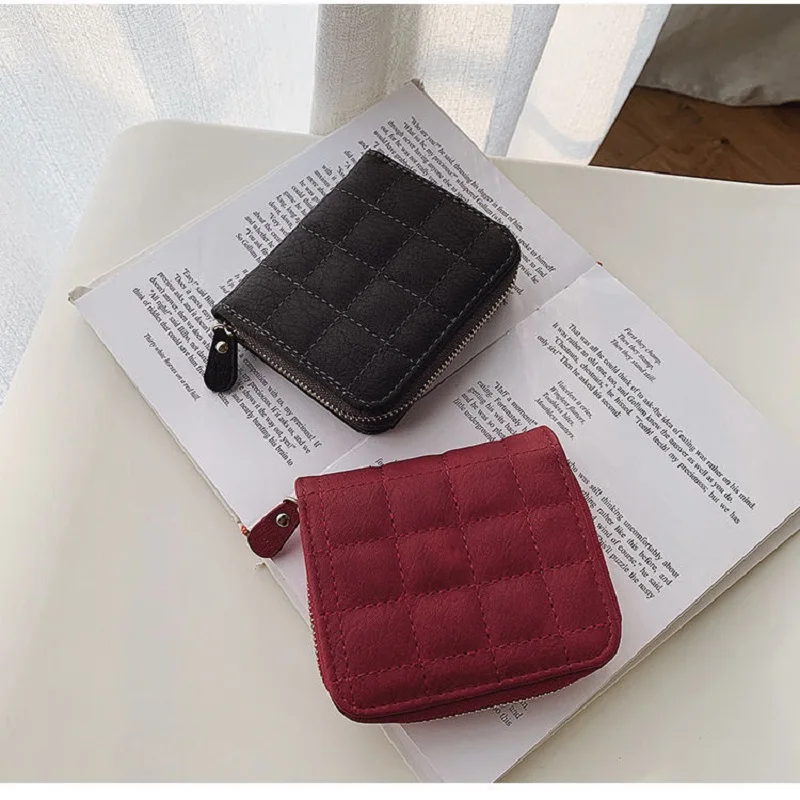 Elegant Women's Minimalist Leather Clutch with Embroidered Design