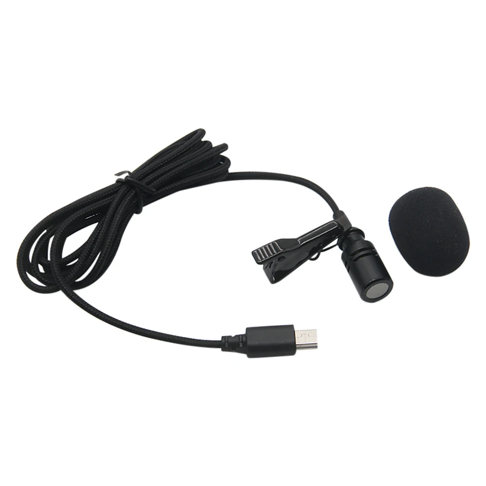 Gros plan sur le microphone externe mini USB avec clip pince, montrant le connecteur et la grille