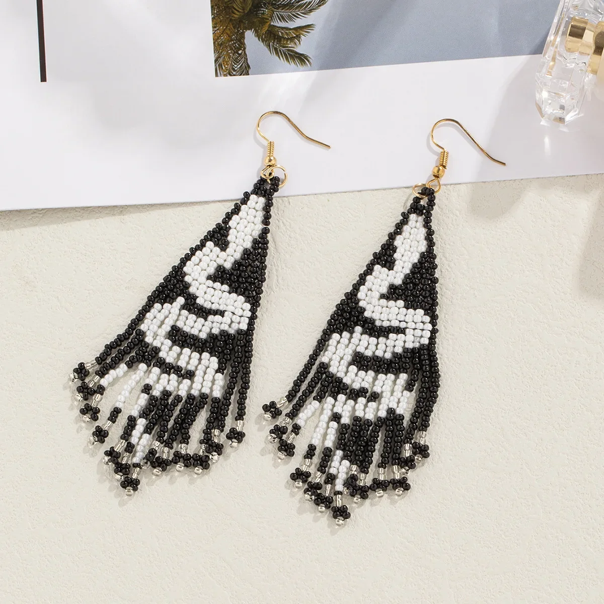 

Beaded earrings Tassel The snake Design Originality Hand knitting Bohemia Alloy Tide Simple Rice bead earrings