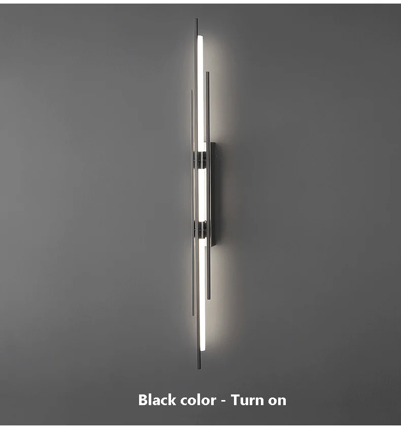 A stylish wall light with a black color turn on, perfect for contemporary lighting.