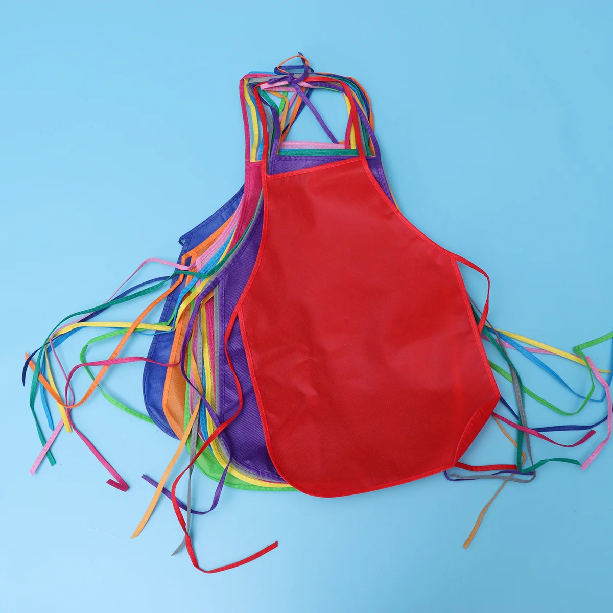 

12pcs Children's Artists Aprons Non-woven Fabric Disposable Painting Aprons for Class Crafts Painting Activities（Random