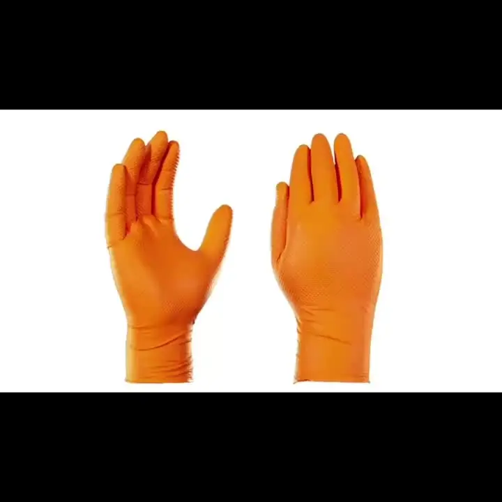 Gants jetables orange dans leur boîte d'origine, prêts à l'emploi.