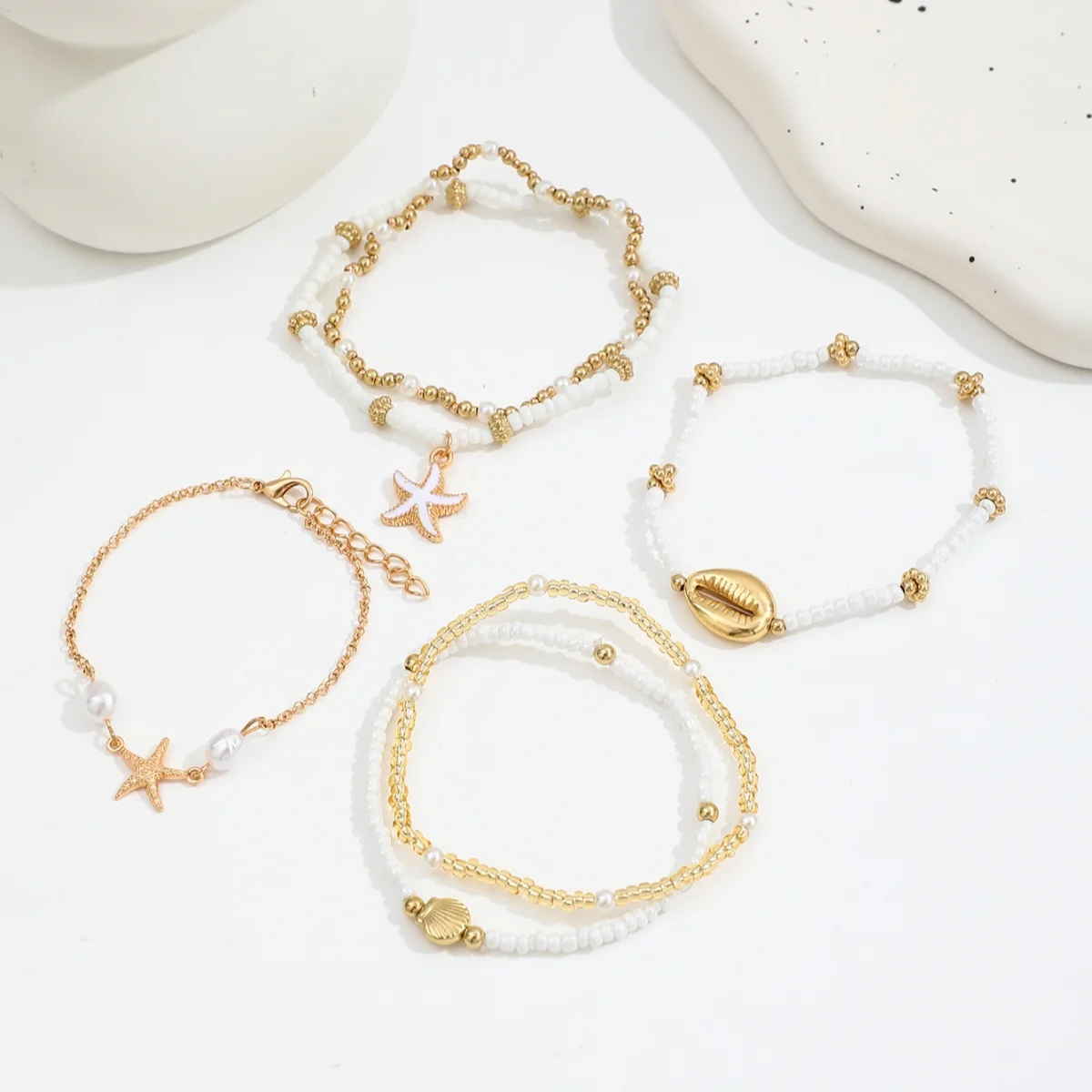 Conjunto de pulseiras vintage de missangas com estrela e concha_voghion.com