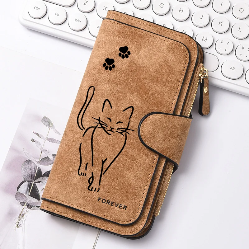 Featuring a cat motif this women's long wallet offers multiple card slots a coin pocket and a cell phone pouch A perfect gift