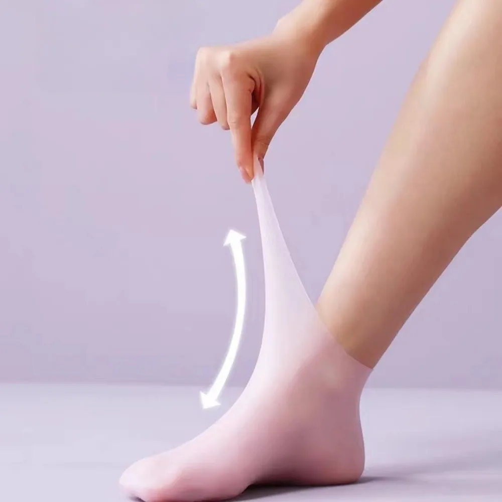 남성과 여성을 위한 2개의 실리콘 발 관리 양말, 보습 및 보호, 건조하고 갈라진 발뒤꿈치를 부드럽게 하여주는 필수 발 관리 도구