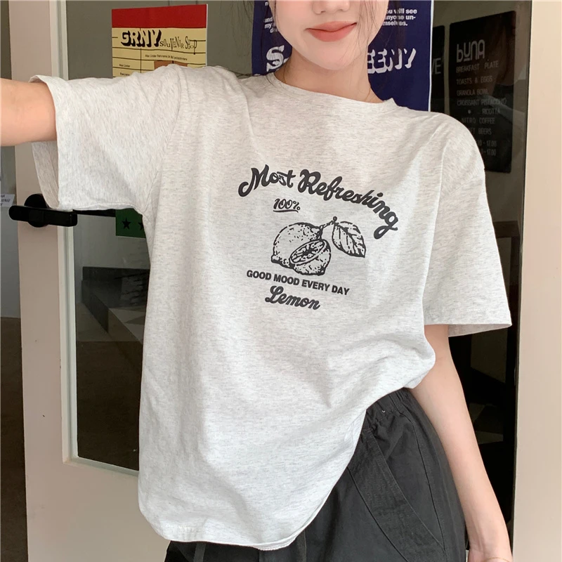 

2024 Xia Xin Korean short sleeved T shirt women y2k personalized loose right shoulder round neck simple ins half sleeved top