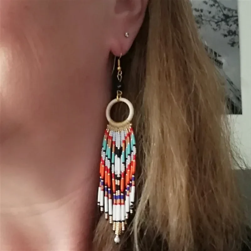 

Fringed earrings Hand woven Versatile circle Long tube fashion personality Bohemia alloy ma'am Rice bead earrings