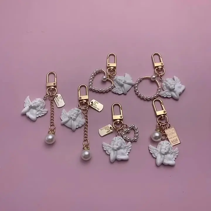 Boutique francese profumato brezza perla profumo catena fiore di camelia portachiavi chiave per auto ciondolo borsa donna ragazza portachiavi regalo gioielli  36