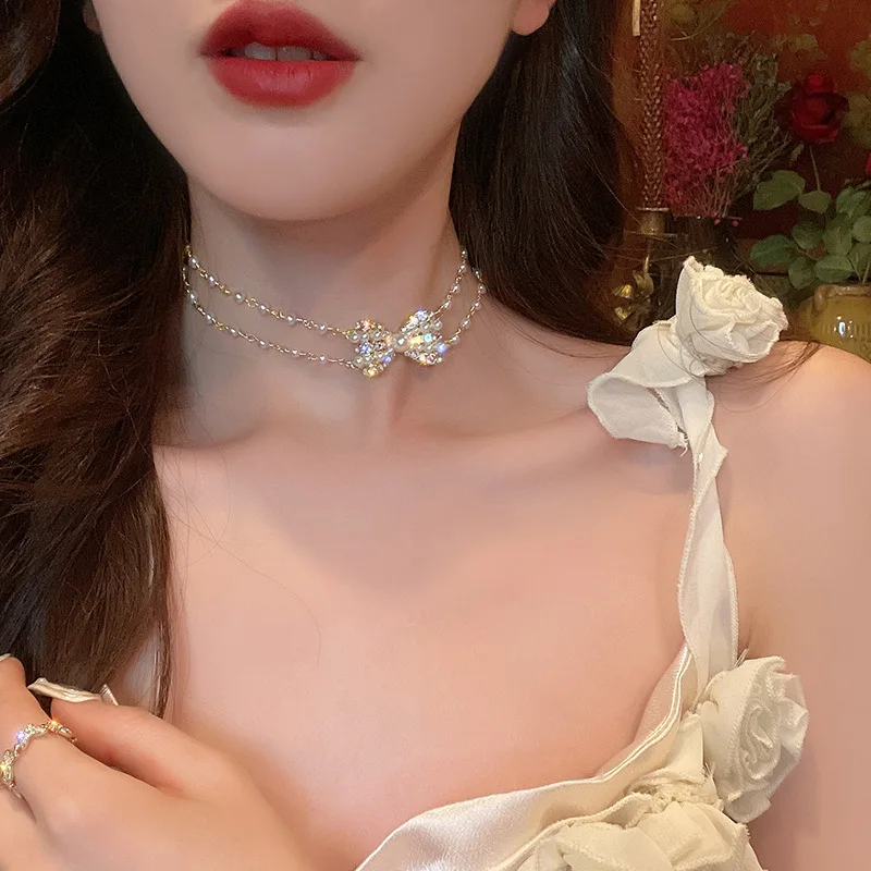 

Honeypotson Pearl choker 2022 new fashion short bow necklace female light luxury small fairy color drill clavicle chain
