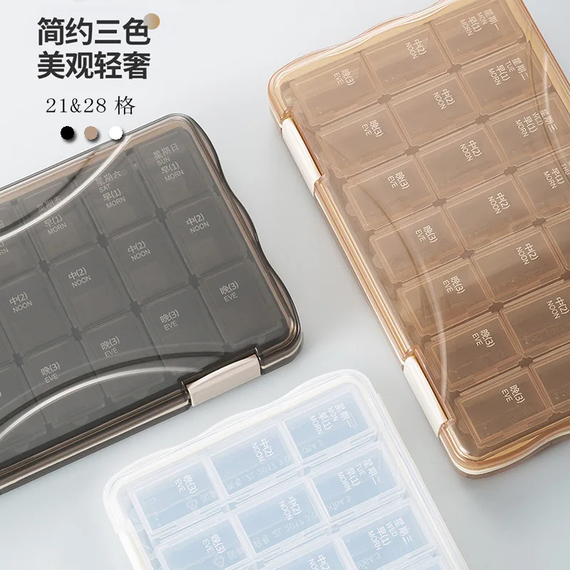 Multi color medicine box, portable for 7 days per week, with 21 compartments and 28 compartments for storage. Multi compartment