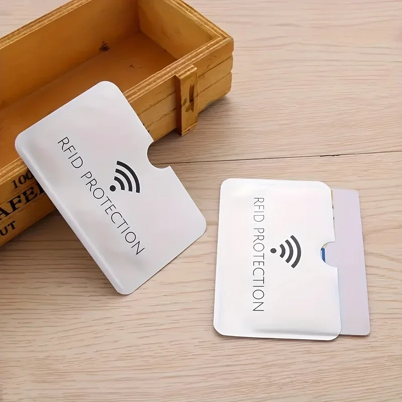 Slim aluminum RFID card sleeve placed inside a wallet slot