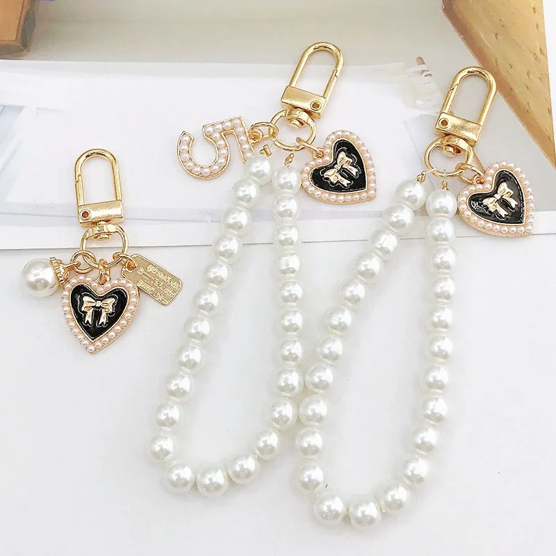 

Deluxe beaded bracelet mobile phone chain acrylic pendant is suitable for iPhone women's gold anti-loss chain pendant key chain