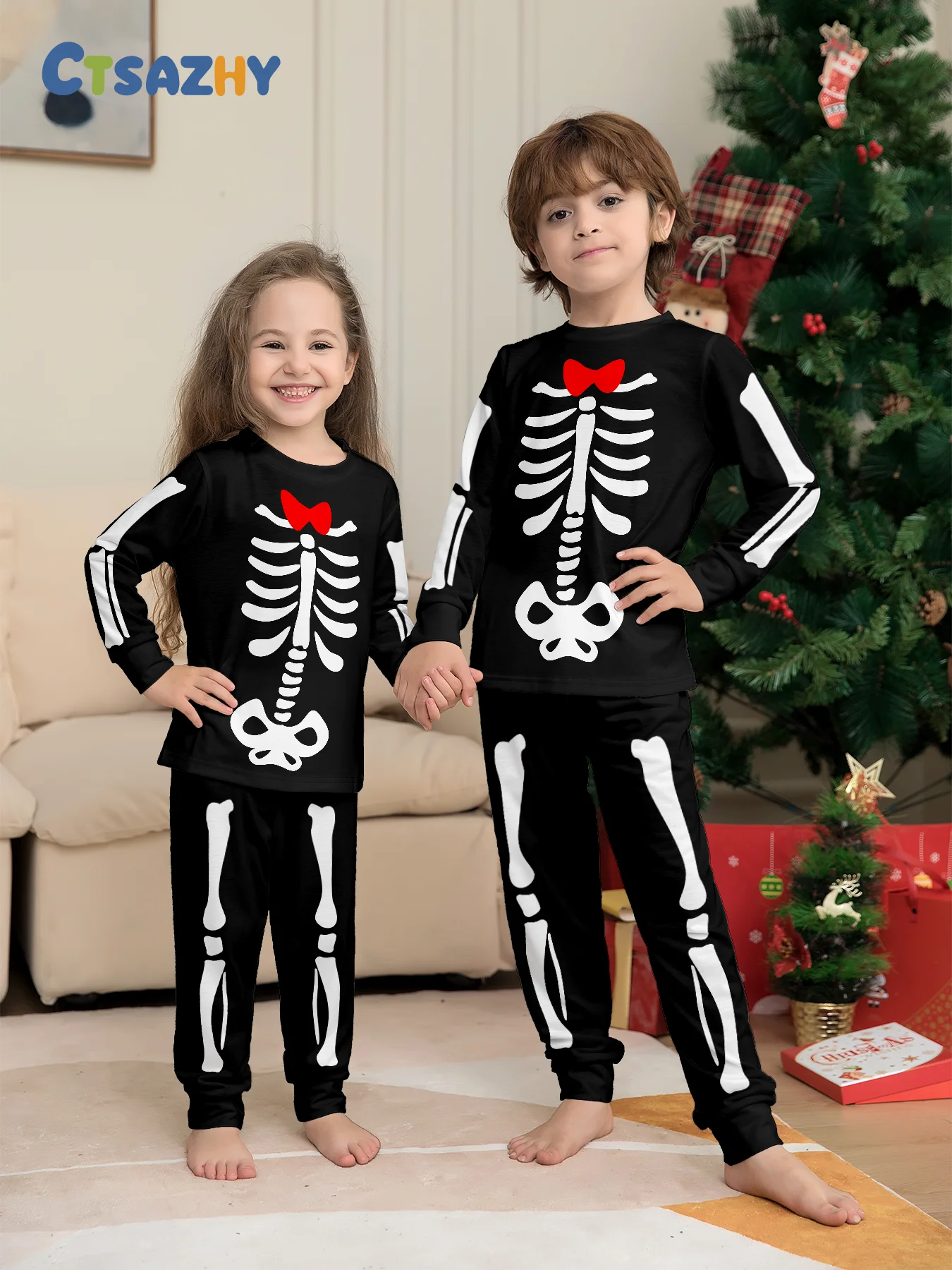 ملابس نوم للأطفال في الهالوين - مجموعة بيجامة ذات هيكل عظمي أسود وفيونكة حمراء للأطفال