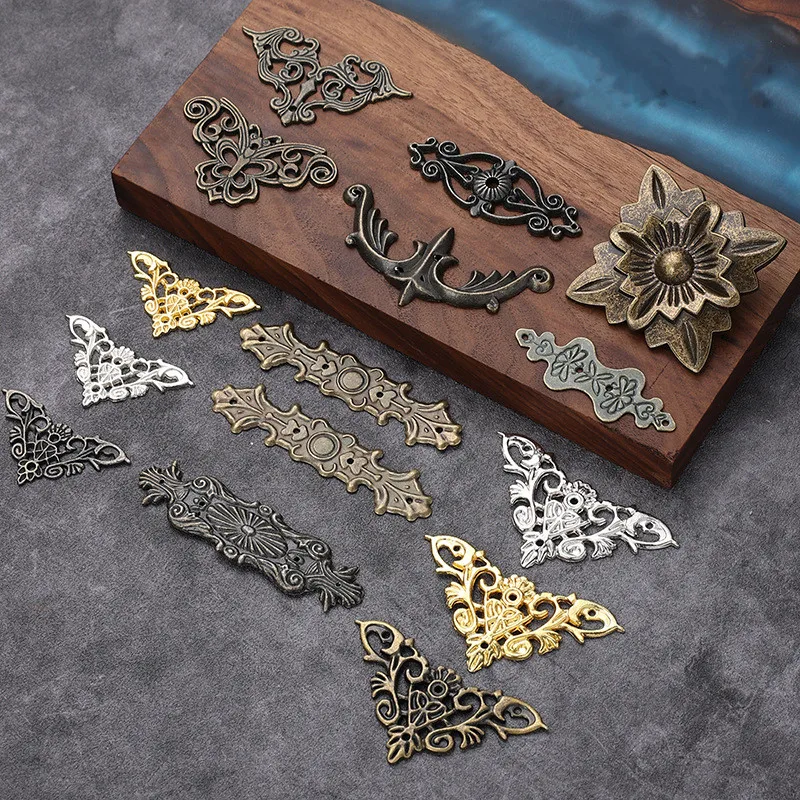 https://ae01.alicdn.com/kf/Sf79fd51f6a5547a2ad8825f83e0bc1fa4/4pcs-Metal-Corner-Protector-Bracket-Hemming-Corner-DIY-Flower-Pattern-Protection-Hardware-Accessor-Book-Photo-Album.jpg