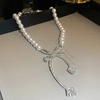 Collier avec nœud en perles et strass pour femmes, mode légère, Niche de luxe, chaîne de clavicule, nouvelle personnalité, bijoux de fête 3