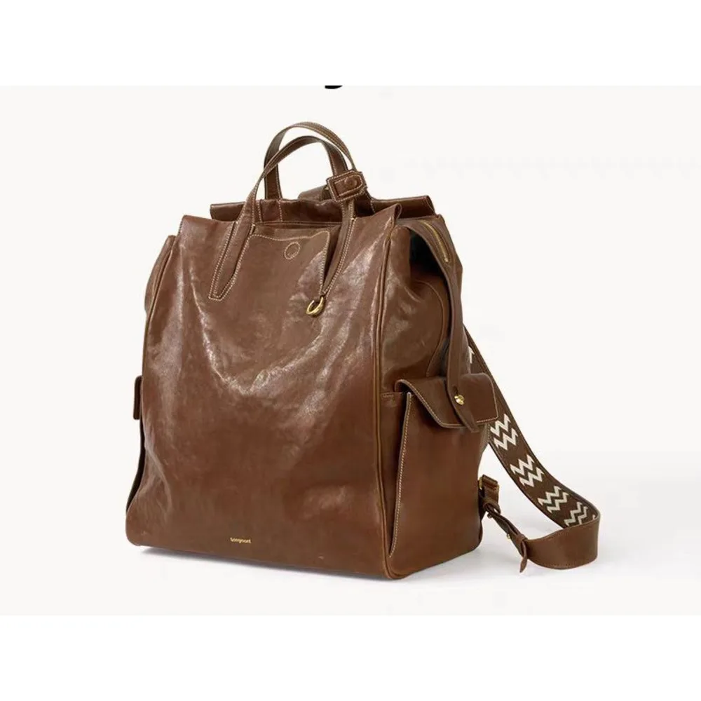 At the foot of Mountain, there is a backpack called series large unisex vegetable tanned leather_voghion.com