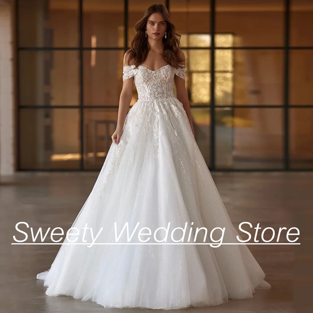 

Блестящее свадебное платье с открытыми плечами, V-образным вырезом, аппликацией, открытой спиной и шлейфом