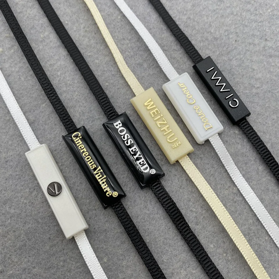 

Custom 3d Embossed Brand Name Logo Garment Hangtag String Loop Plastic Seal Tag Sustainable Hang Tag String Lock