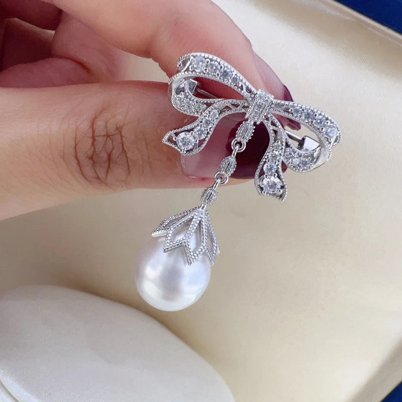 

MeibaPJ 10-11mm Natural White Rice Pearl Bow Brooch S925 Solid Silver Corsage Fine Jewelry For women's Gift