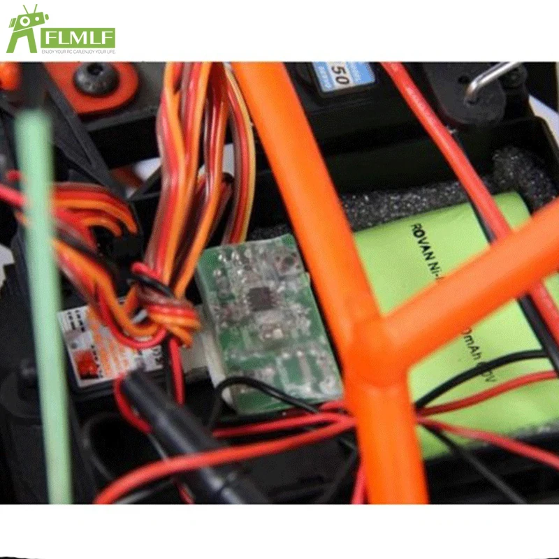 Détail du boîtier de l'interrupteur RC à distance pour moteur à gaz, avec étiquetage des connexions.