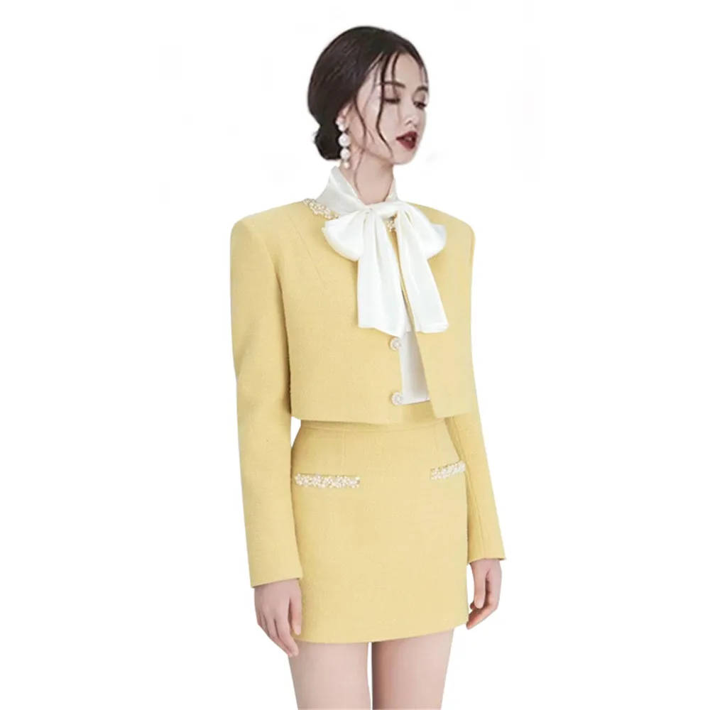 

Yellow ladies small fragrance short coat suit female spring 2023 new luxury temperament A-word short skirt two-piece suit.