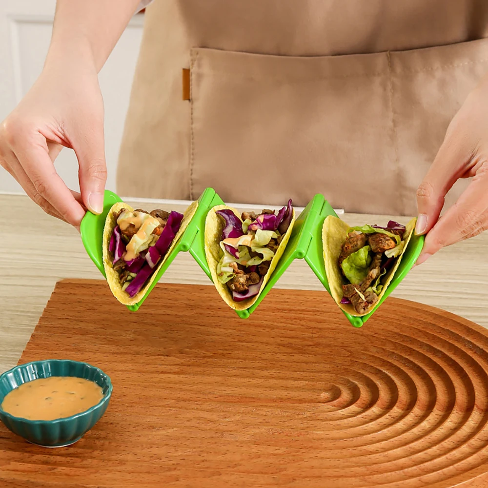 https://ae01.alicdn.com/kf/Sf8cb0a6cf1e34db3b3dc5f72dab1171b1/Foldable-Taco-Holder-Mexican-Pizza-Roll-Shelf-Burrito-Potato-Chips-Rack-Shells-Taco-Rack-Multifunctional-Kitchen.jpg