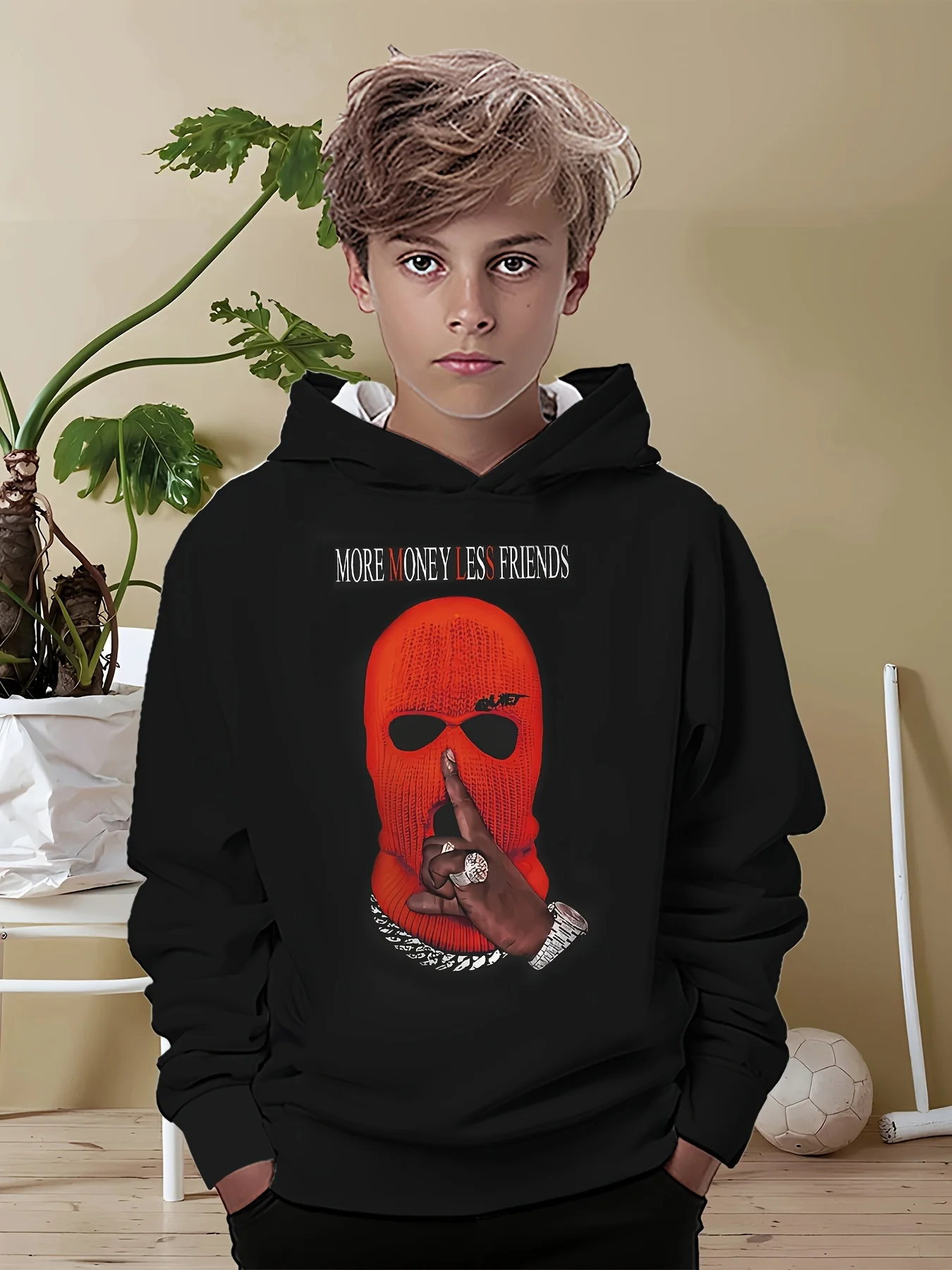 Smiling bpy wearing a colorful 3D hoodie with long sleeves, standing outdoors with playful energy mask