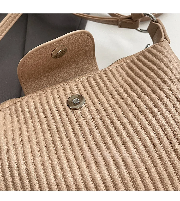Niche design pleated striped 2024 new women's versatile and simple single shoulder pillow crossbody armpit bag_voghion.com