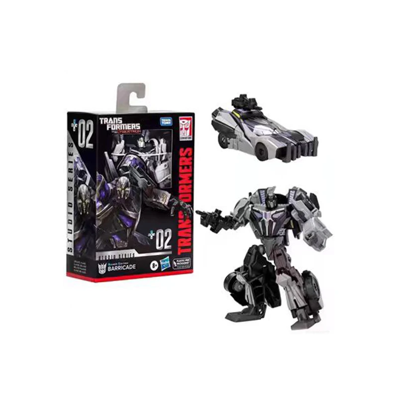 Transformers Studio Series 82 - Action Figure Ratchet Autobot (11,4 Cm) - Da Robot A Veicolo Cybertroniano - Con Accessorio E Fondo Scena