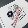 New South Korea Dongdaemun Gentle Cream Colored Leather Rope Contrasting Sun Flower Beads Phone Chain Keychain Bag Pendant 3