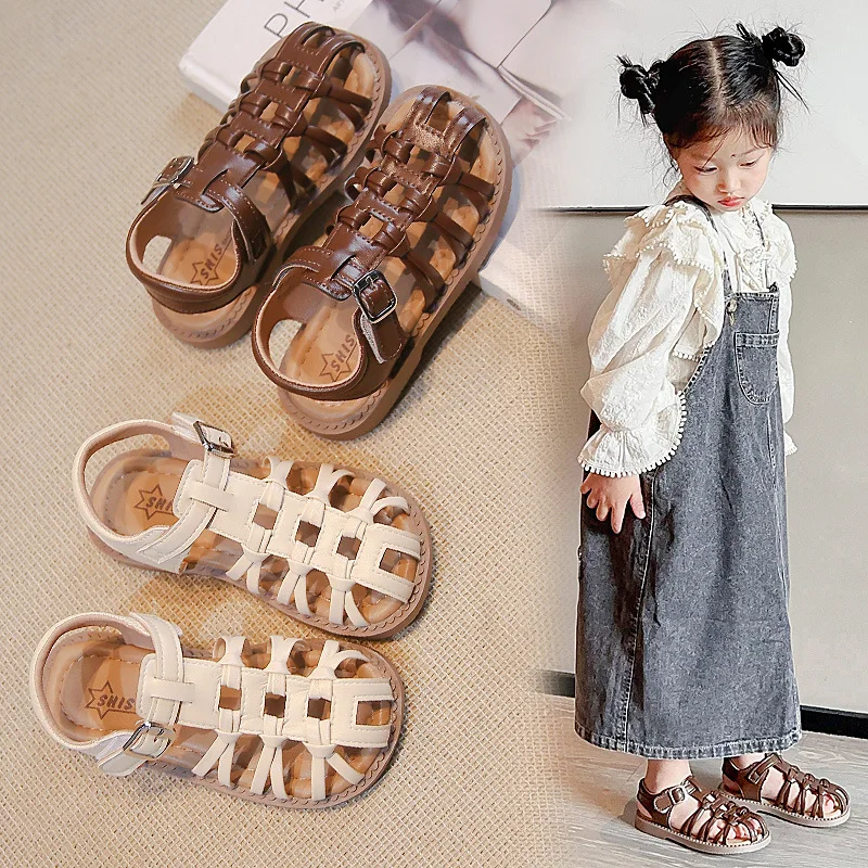 

Детские плетеные сандалии Новинка 2024 модная обувь в римском стиле на плоской подошве для девочек универсальная пляжная обувь для летних отпусков грязеотталкивающая