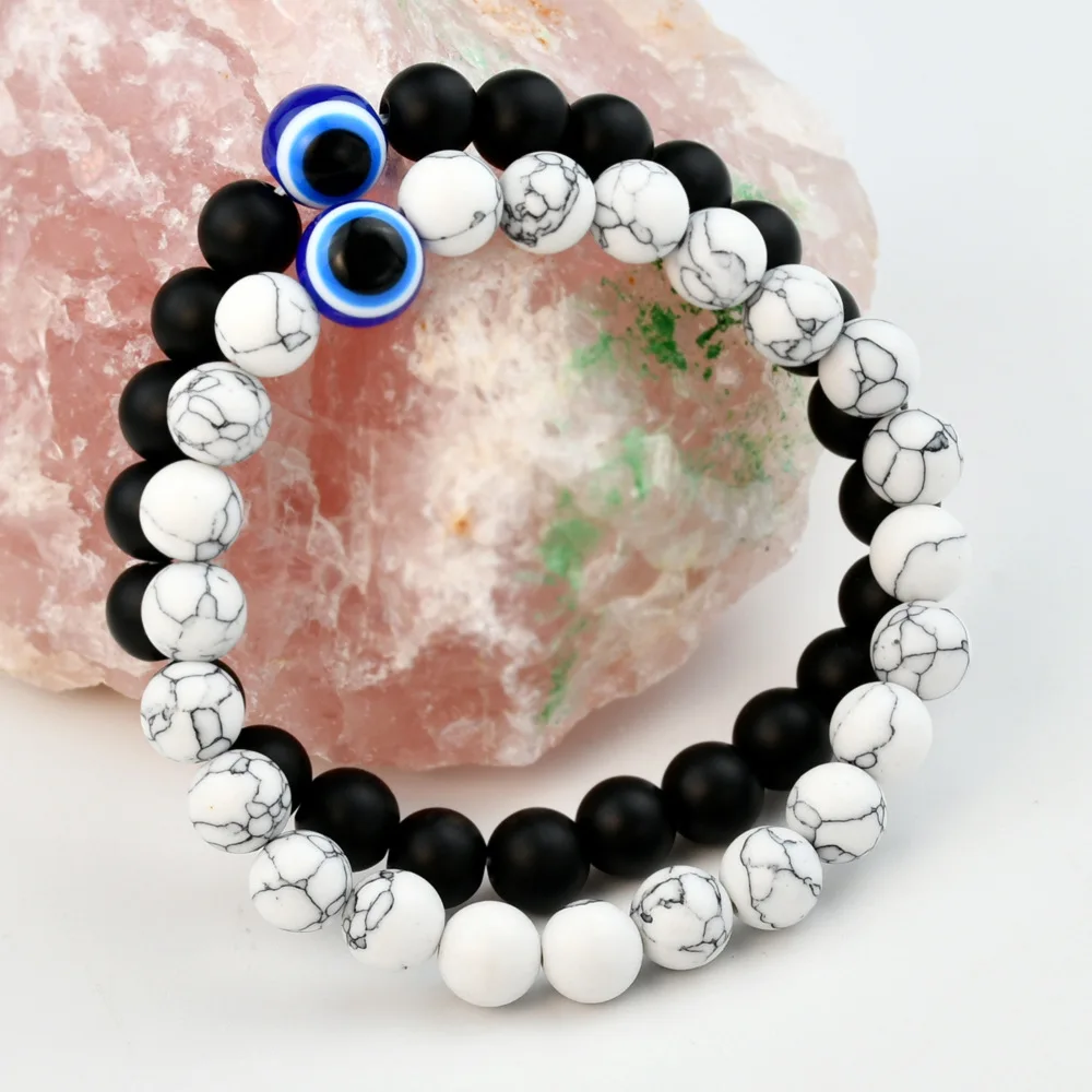 Unisex stone strand bracelets with copper alloy accents and ball pattern beads.