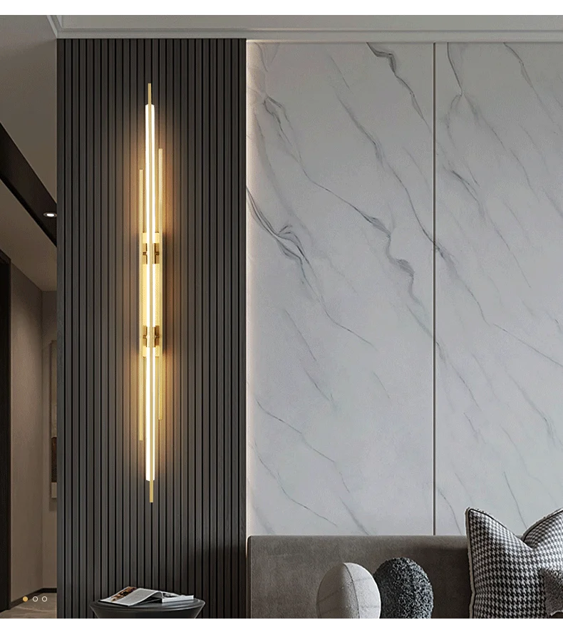 A stylish living room with a contemporary lighting design and a marble wall.