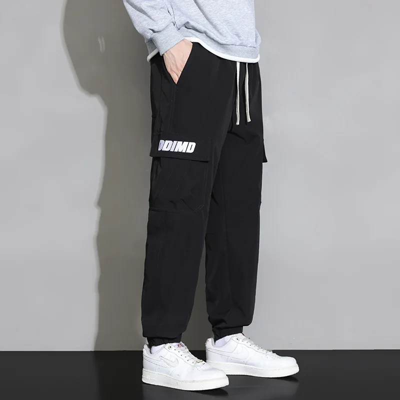 Spring Autumn New Solid Color Fashion Elastic Waist Cargo Trousers Man High Street Casual Pockets Drawstring Ankle Length Pants