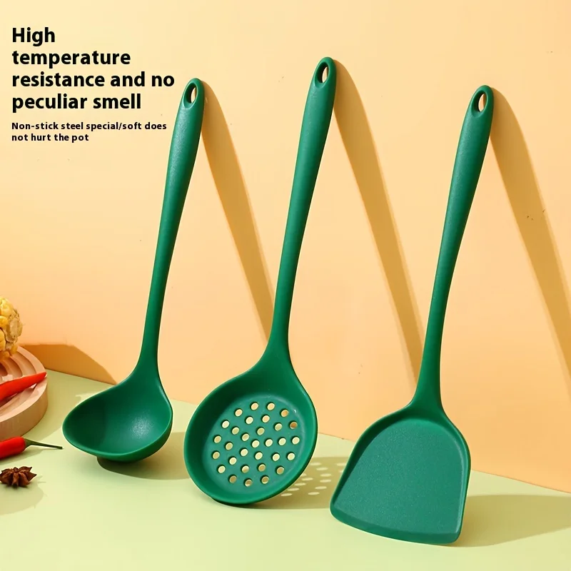 Three-piece Dark Green Silicone Kitchenware Set, Including A Silicone Spatula, A Spoon, and Slotted Spoon.