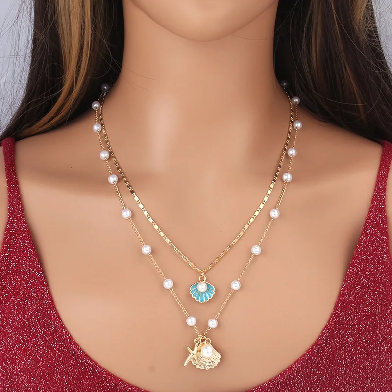 Coastal Pearl Layered Shell Necklace Sf9fc682fb3864a00b20e22ed786e51c49