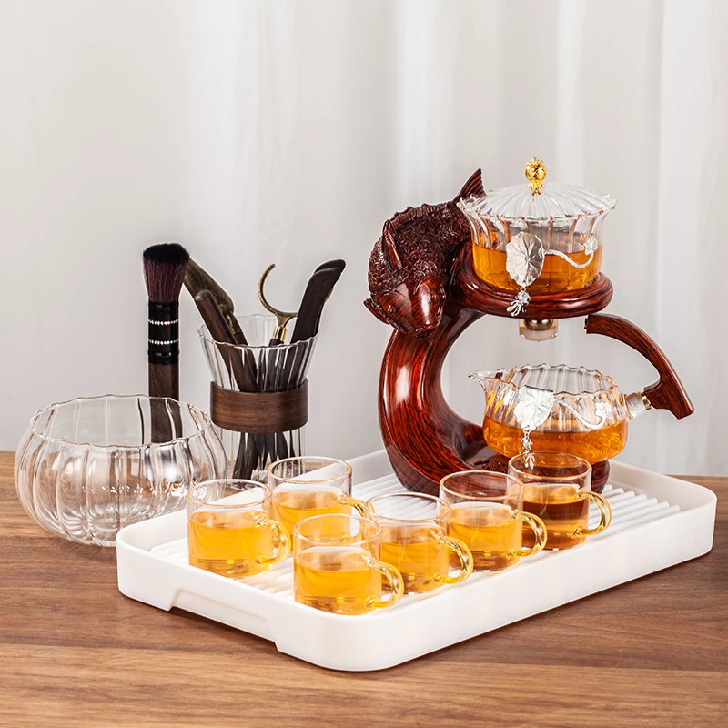 https://ae01.alicdn.com/kf/Sfa24a8ddc298482883afb30554a9639aL/Creative-Fish-Teapot-Full-Automatic-Glass-Teapot-Infuser-Magnetic-Water-Diversion-Heat-resistant-Kungfu-Tea-Drinking.jpg